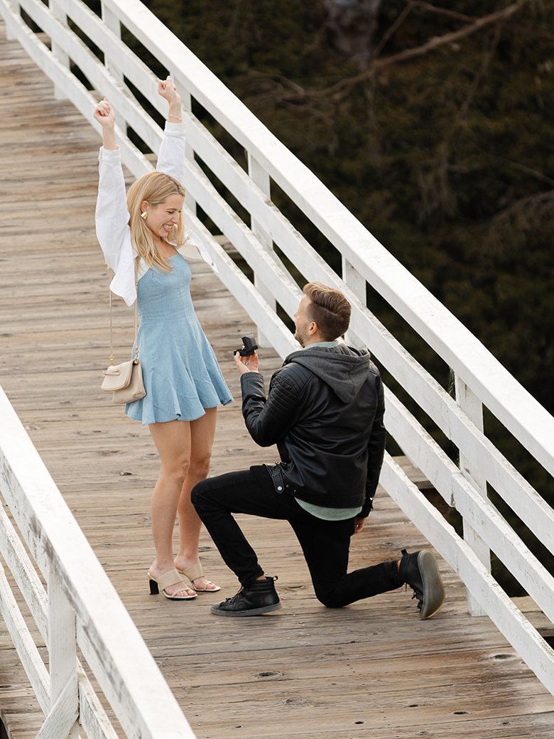 Serik proposing to Annie on the Quince Street Bridge